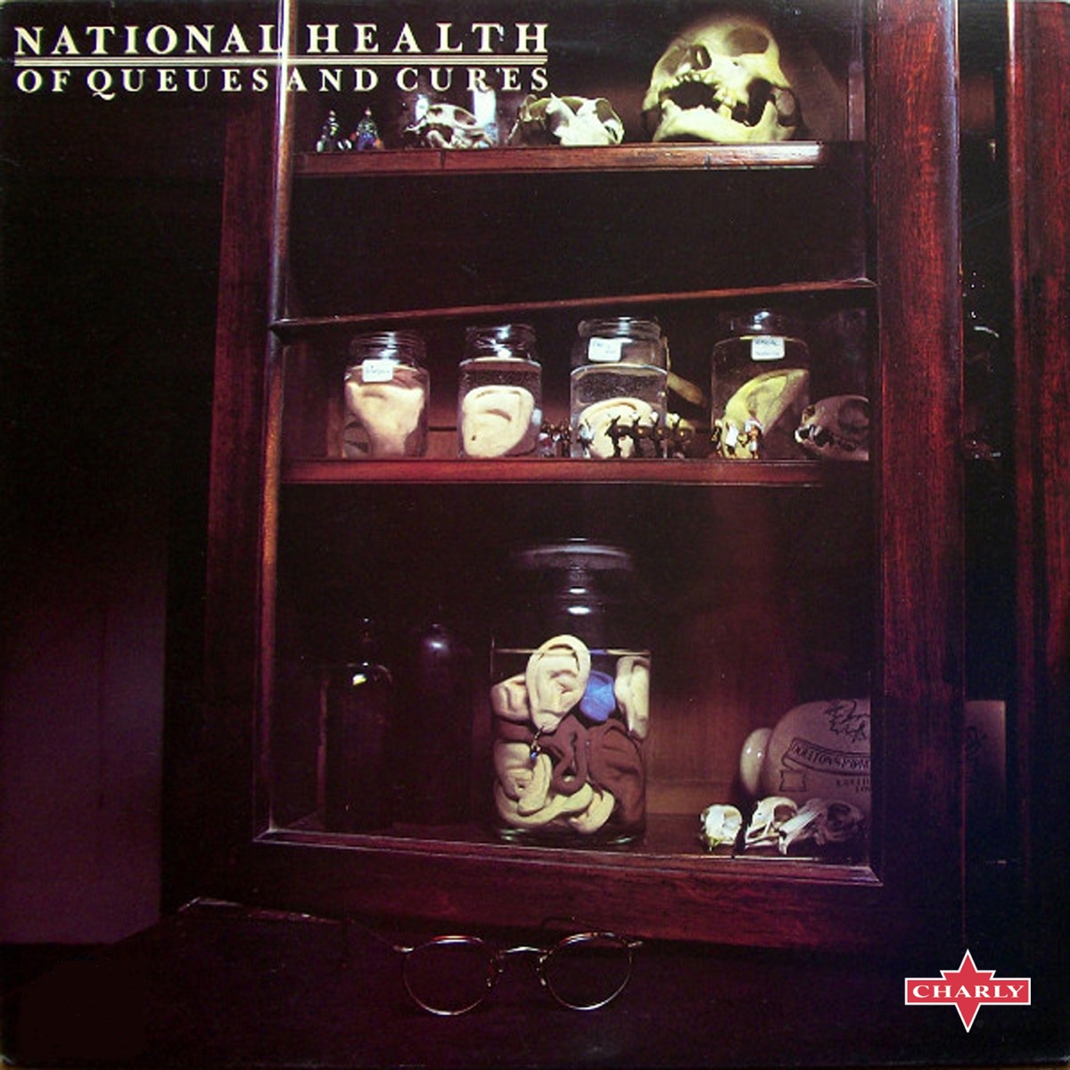 Album cover for Of Queues and Cures by National Health