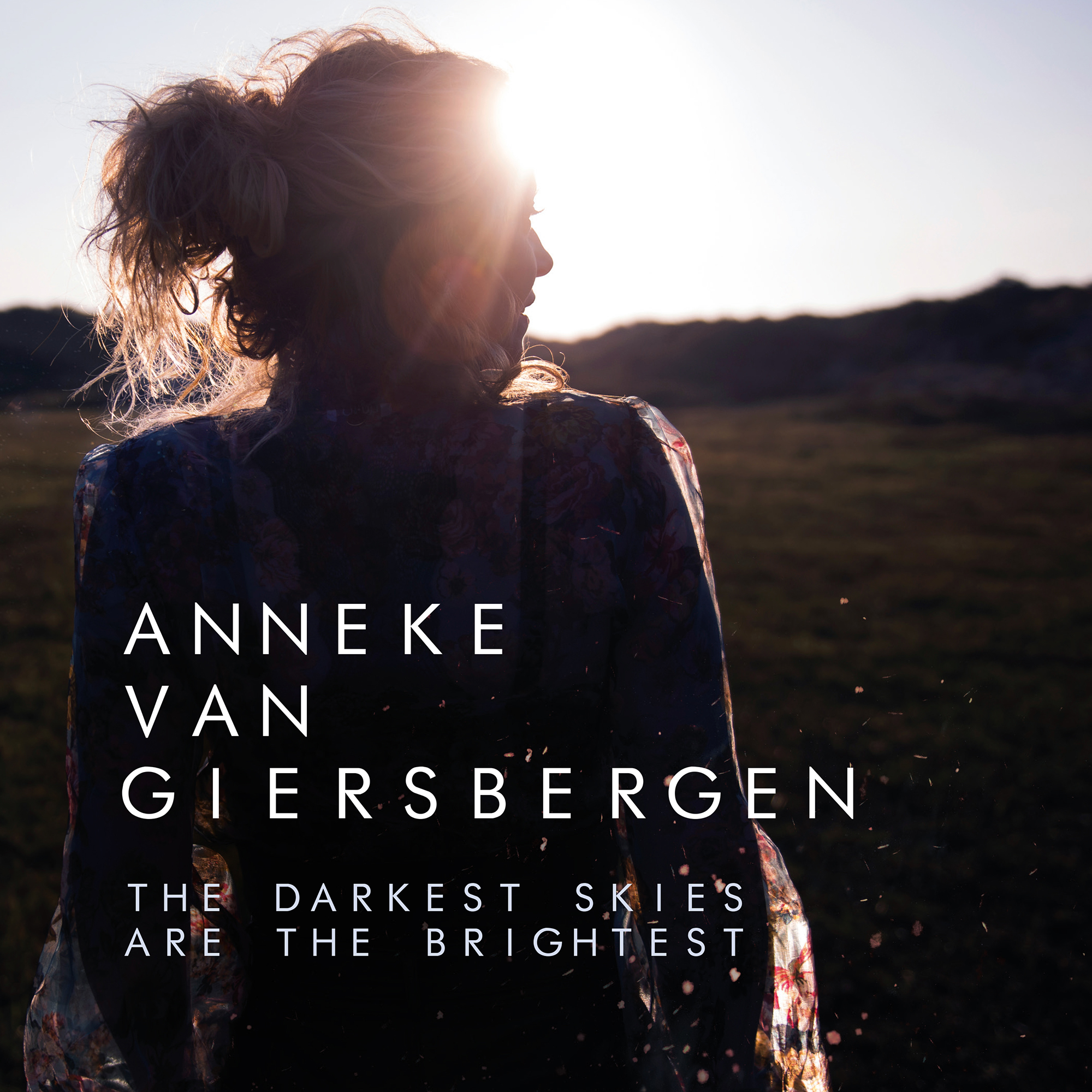 Album cover for The Darkest Skies Are the Brightest by Anneke van Giersbergen